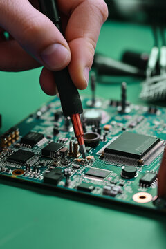 A person working on a circuit board created with Generative AI technology