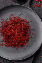 Red thin hot chili threads on a dark background