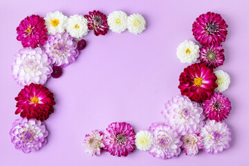 Creative layout made of flowers dahlias. Floral Greeting card. Colorful autumn flower background with space for text. Nature trendy decorative design. Nature concept. Flat lay.