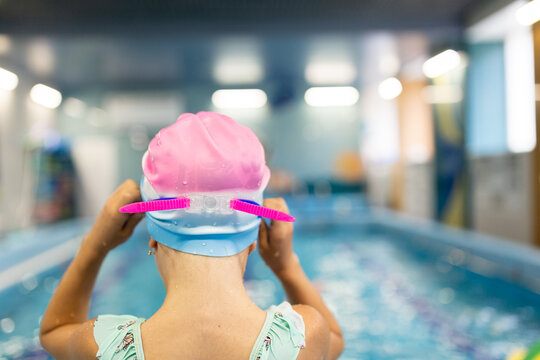 Preschooler girl ready for indoor swimming session