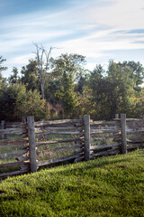 Old fence around a rural grass field