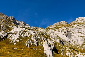 Rocky steep mountain slopes at Luknja bellow Bovski Gamsovec in Slovenia