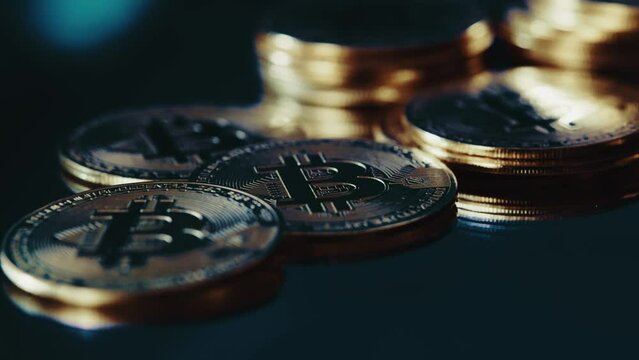 Crypto currency Bitcoin extreme close up stock footage. Golden BTC coins. Blockchain technology and mining.