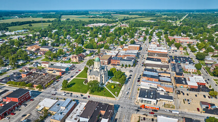 Aerial downtown Columbia City with courthouse and shops with distant houses