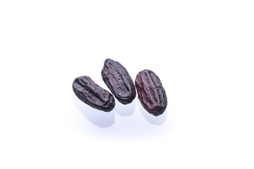 three dry black rice isolated on white background