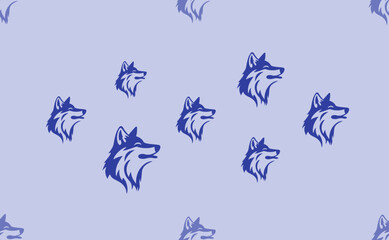 Seamless pattern of large isolated blue wolf heads. The pattern is divided by a line of elements of lighter tones. Vector illustration on light blue background