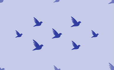 Seamless pattern of large isolated blue bird symbols. The pattern is divided by a line of elements of lighter tones. Vector illustration on light blue background