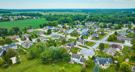 Rural neighborhood with farmland between neighborhoods aerial