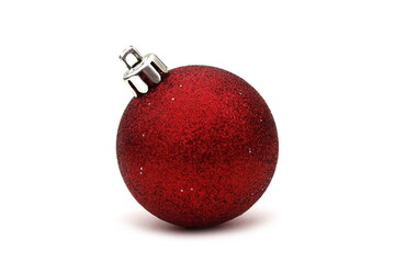 One red ball with sparkles lies on a white background.