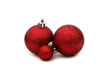 Red balls with sparkles lie against the background.