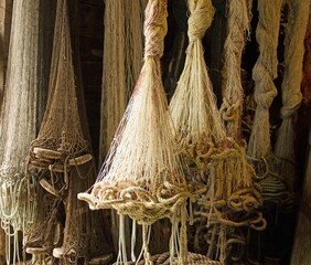 Old fishing nets hanging in a shed