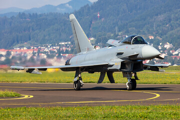 Military fighter jet plane at air base. Airport and airfield. Air force flight operation. Aviation...