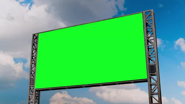 Timelapse: blank green billboard or large display and moving white clouds against blue sky. Consumerism, time lapse, advertising, green screen, template, mock up, copy space and chroma key concept