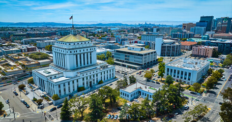 Aerial Alameda County Superior Courthouse in downtown Oakland California with distant San Francisco - obrazy, fototapety, plakaty