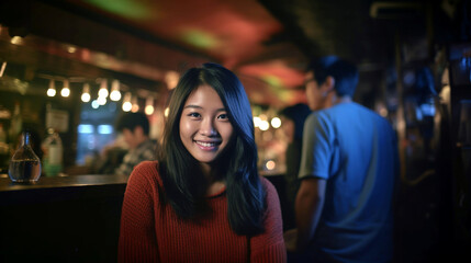 Fototapeta premium Asian woman smiles in dimly lit bar, joyful atmosphere.