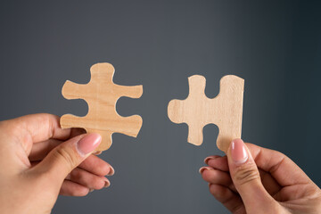 Woman holding puzzle pieces