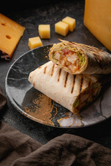 Shawarma in a plate on a dark background