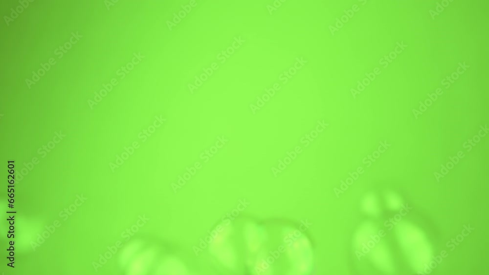 Poster group small soap bubbles float on a green background in empty space. close up. blowing transparent i