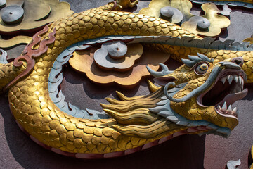 Dakshinkali, Nepal: details of a golden snake, part of the ornaments of the statue of Guru Rinpoche (Padmasambhava, Born from a Lotus), tantric Buddhist Vajra master, built in 2012 on a hilltop