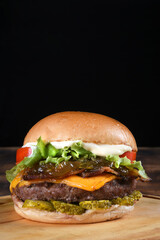 sandwich with beef burger on brioche bread salad egg and bacon street food fast food