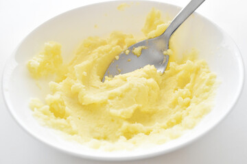  Creamy mashed potatoes with butter and milk in a white bowl. Healthy and dietary food.