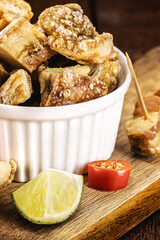 pork belly meat snack, crispy crackling typical of minas gerais, served with brazilian cachaça, bar food