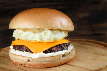 sandwich with beef burger on brioche bread salad egg and bacon street food fast food