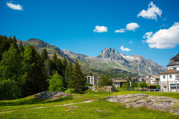 Fototapeta na wymiar Quaint alpine Swiss town traditional mountain scenery river