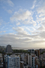 Fototapeta premium Aerial view of the central area of Porto Alegre with the Guaiba River in the background - sunset with clouds