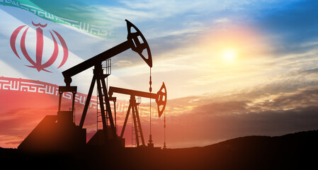 Oil drilling derricks at desert oilfield with Iran flag. The change in oil prices caused by the...