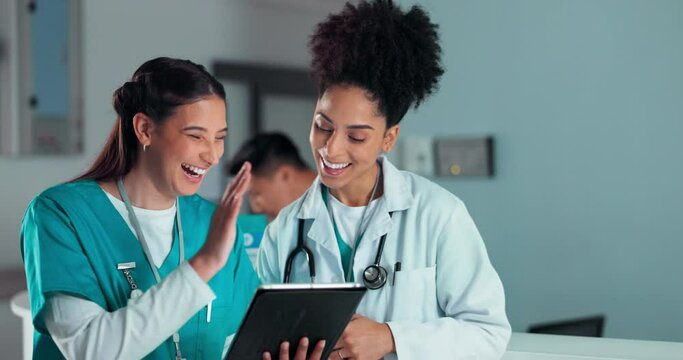 Teamwork, high five and doctors on tablet in hospital for research success, report advice and telehealth. Healthcare, clinic and women talking on digital tech for medical service, results and meeting