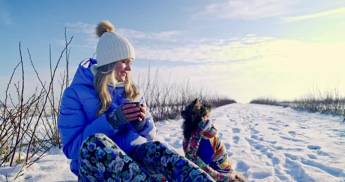 Rest during a winter trip into the wilderness with your dog.