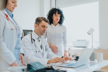 Medical Professionals Discussing and Analyzing Test Results with Patient