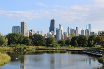 Fototapeta na wymiar Chicago, Illinois, USA; 4 October 2023: View of the city of Chicago from the Lincoln Park Zoo nature boardwalk. IN front of the lake.