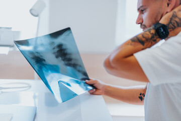 Experienced Radiologist Giving Diagnosis to Patient During Clinic Visit