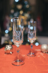 Empty champagne glass on Christmas dinner table.