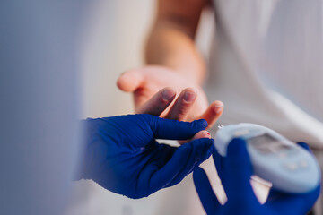 In a hospital, a blue-clad doctor conducts a thorough medical examination, checking blood pressure and sugar levels, performing hearing exams, and providing professional care.