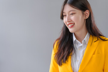 Yellow suit female asian people real estate agents and loan providers at work. Business...