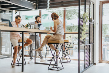 Focused Multiracial Group of Professionals Working Together in an Office for Content Strategy and...