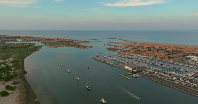 Aerial view of port Leucate with mediterranean sea in background, sunset france aude occitanie