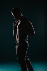 Fototapeta na wymiar Powerful Athlete Flexing Muscles in Studio - Fitness Transformation Inspiration