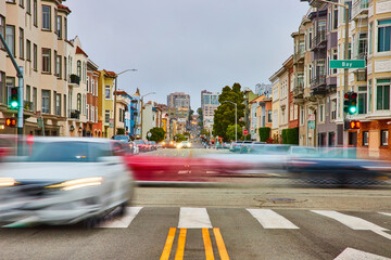 Blur motion of moving vehicles through San Francisco intersection with long road © Nicholas J. Klein