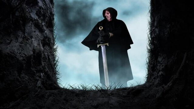 Open Grave Looking at Death with Sword 4K Loop features a view from inside an open grave of a disfigured figure in a black hood holding a broadsword in a loop.