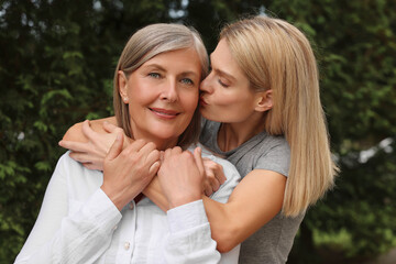 Fototapeta premium Happy mature mother and her daughter outdoors