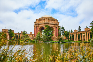 Open rotunda and colonnade at Palace of Fine Arts view from across lagoon