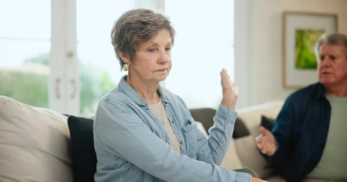 Senior couple, sofa and fighting on divorce, stress and conflict on couch in living room. Elderly people, arguing and angry for cheating, affair and mistake or frustrated, mad and whatever or upset