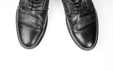 Men's leather shoes on a white background. Formal men's shoes with a narrow, pointed toe. Men's leather business boots.