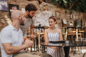 Focused Business Team Discussing Project Strategies at City Coffee Shop
