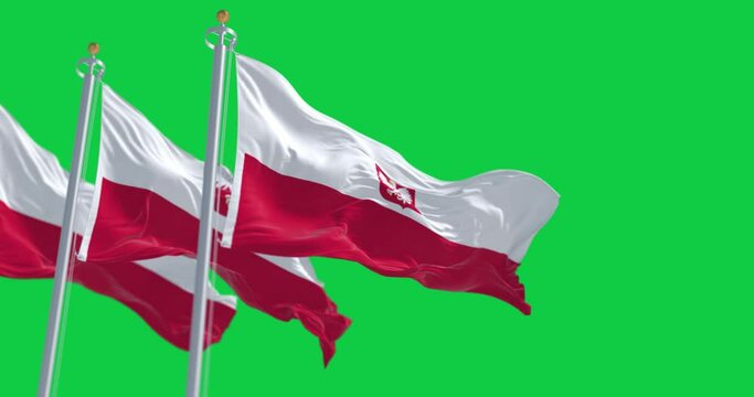 Three national flags of Poland waving in the wind on a clear day