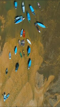 Aerial view of small boats stranded in the nearly dry bed of the Tapajos river in Alter do Chao, Santarem, Brazil, during the amazonian drought in the second half of 2023